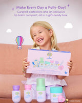 Make Every Day a Polly-Day! Curated bestsellers and an exclusive lip balm compact, all in a gift-ready box. Smiling child holding the Polly Pocket™ × Evereden set box with the five products displayed in front.
