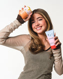 Model holding SPF20 and Face Wash.